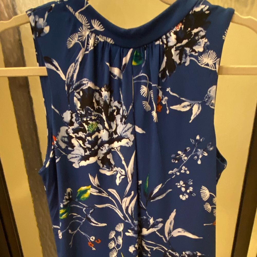 Blue and white floral top, with eye hole on chest.. very beautiful!